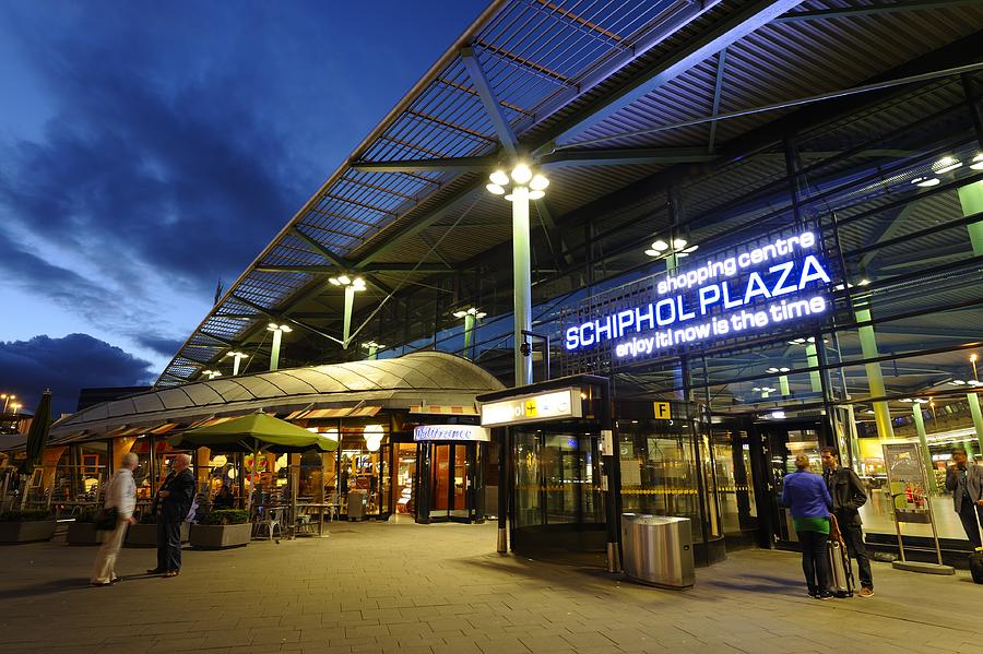 Entrance of Amsterdam Airport Schiphol in the evening Photograph by Vliet