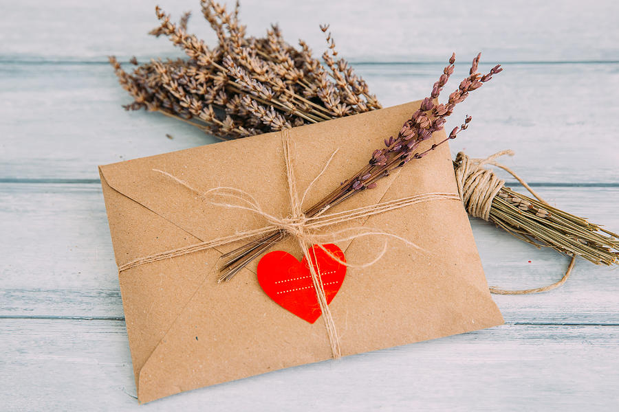 Envelope with heart sticker and dried flowers Photograph by Victoriabee