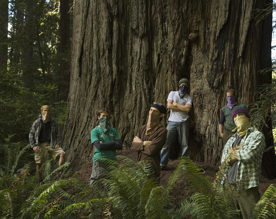 Environmentalists wearing bandanas in forest Photograph by Jupiterimages