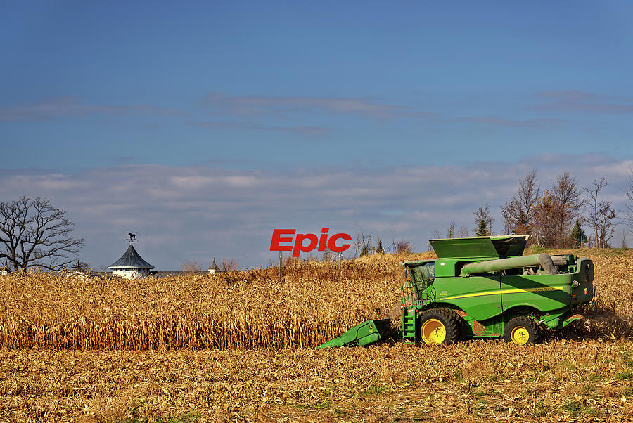 Epic Harvest -  John Deere combine harvesting corn at Epic Systems campus Photograph by Peter Herman