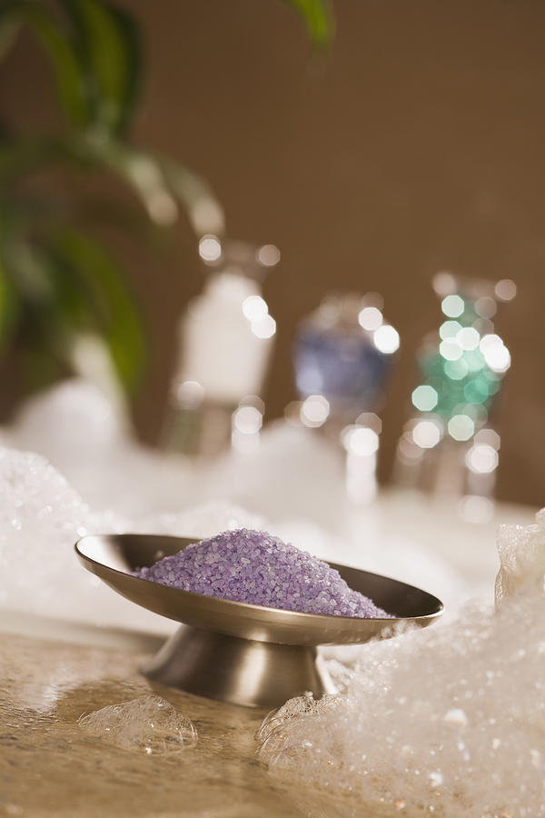 Epsom salts and bath bubbles Photograph by Comstock Images