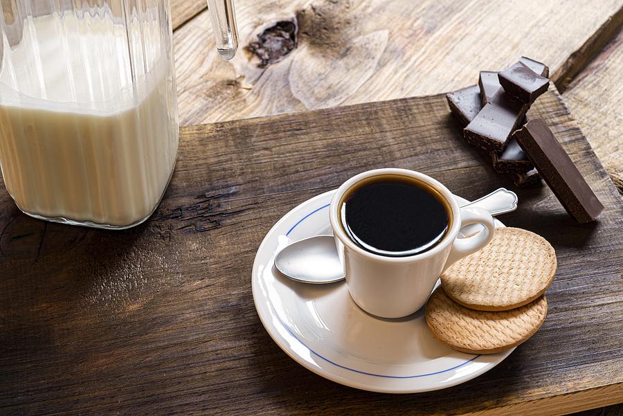 Espresso coffee with cookies on rustic pine wood table Photograph by Fstoplight