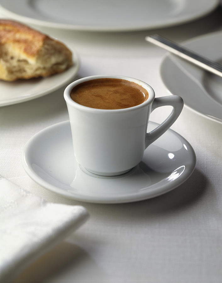 Espresso in cup and saucer Photograph by Anthony Nex