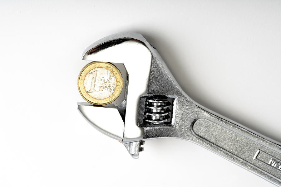 Euro coin in gripper Photograph by Creativ Studio Heinemann