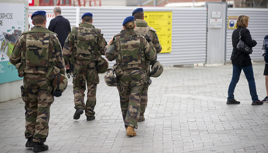 Europe, France, Brittany, Rennes, View Of Soldiers Patrolling Street Near Train Station Photograph by Kypros