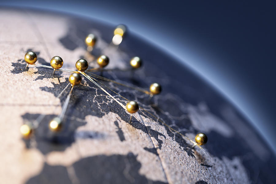 European Connection - Golden pins on cork board globe Photograph by ThomasVogel