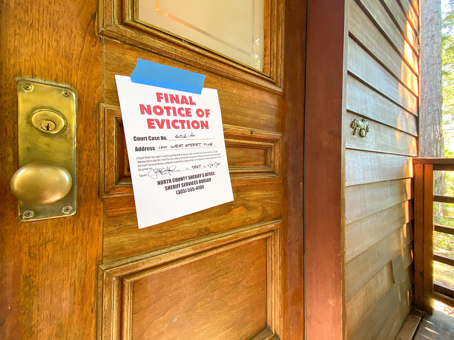 Eviction notice on door of house Photograph by Bill Oxford