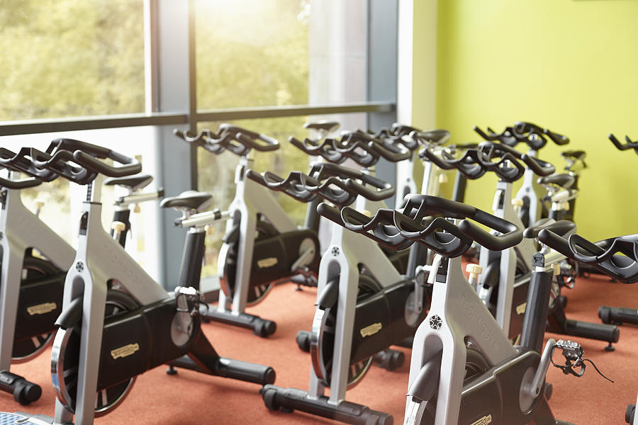 Exercise bikes in a gym for exercise class Photograph by 10000 Hours