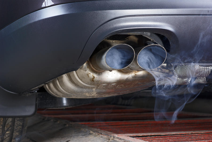 Exhaust pipe of a car - blowing out the pollution. Photograph by Nikamata