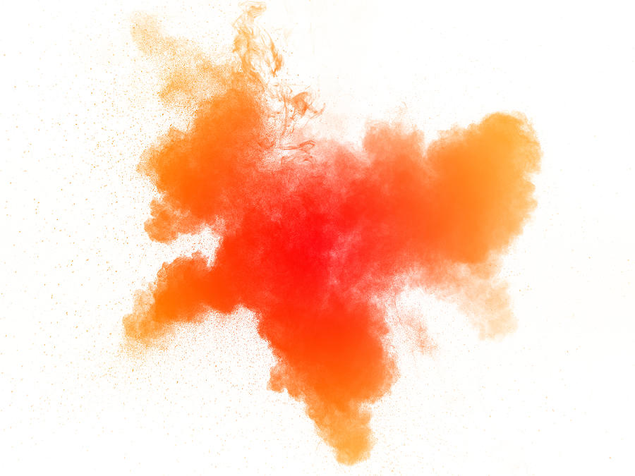Explosion of a cloud of powder of particles of  colors red and orange on a white background Photograph by Jose A. Bernat Bacete