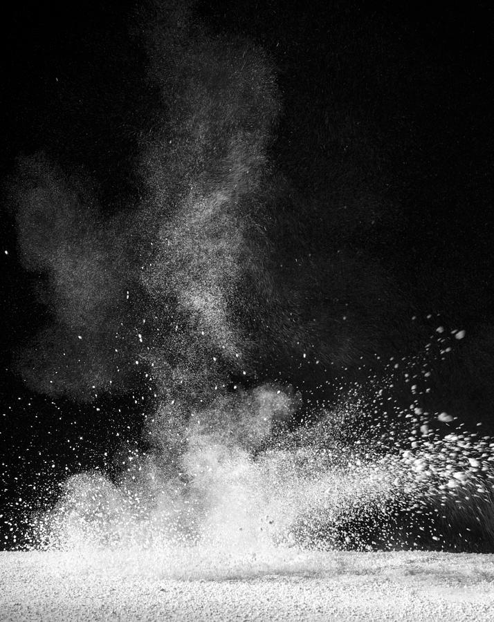 Explosion of a cloud of powder of particles of colors white  and a black background Photograph by Jose A. Bernat Bacete