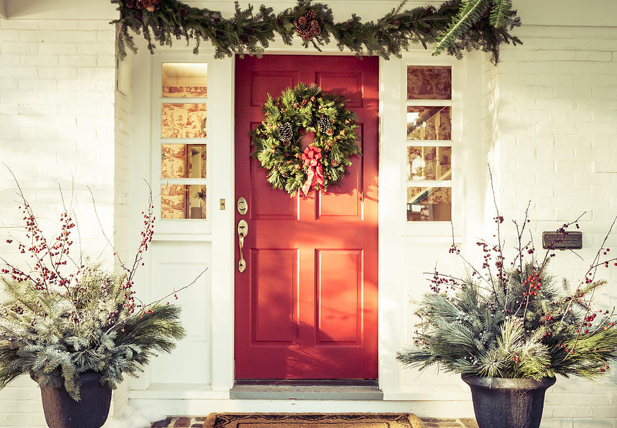 Exterior red door decorated for Christmas Photograph by Laurie Rubin