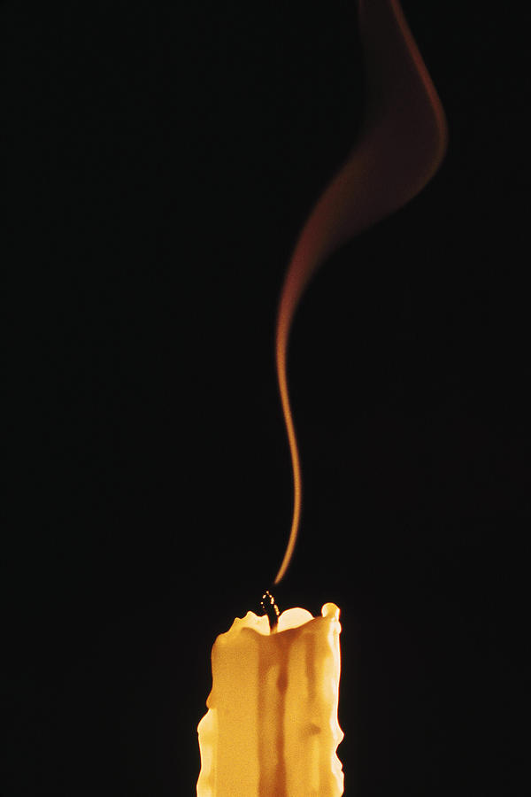 Extinguished candle Photograph by Comstock