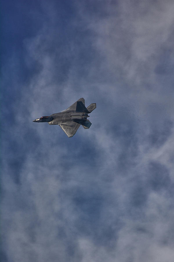 F-22 Banking Around Clouds Photograph by Raymond Salani III