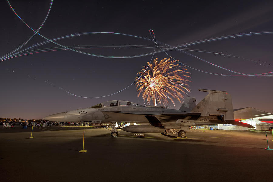 F18 with Fireworks Photograph by Carolyn Hutchins