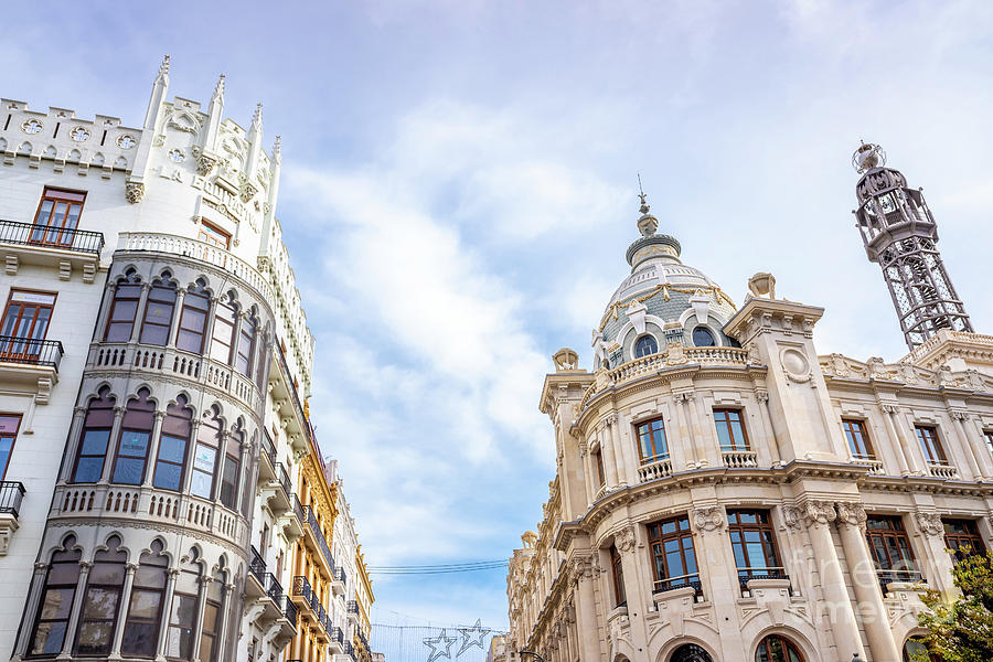 Facades of the buildings of the Plaza del Ayuntamiento de Valencia, on a Sunday, with streets cut to Photograph by Joaquin Corbalan