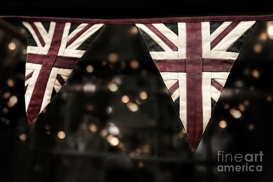 Faded vintage Union Jack bunting with bokeh background. Ideal fo Photograph by Jane Rix