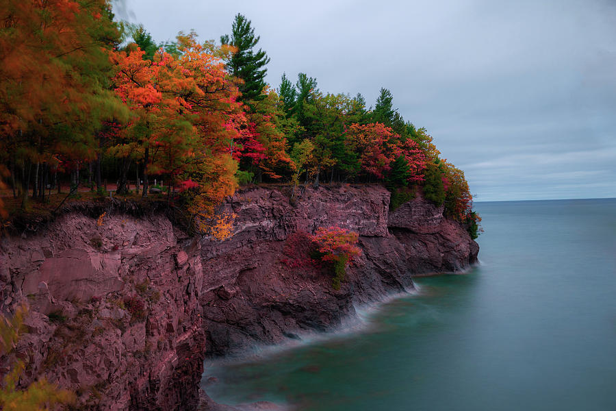 Fall colors on the rocks at Presque Isle Photograph by Jay Smith