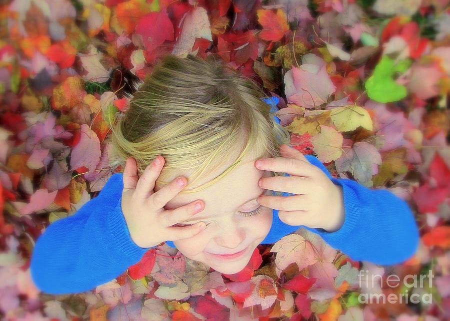 Fall is Playing In A Pile Of Leaves Photograph by Lori Lafargue
