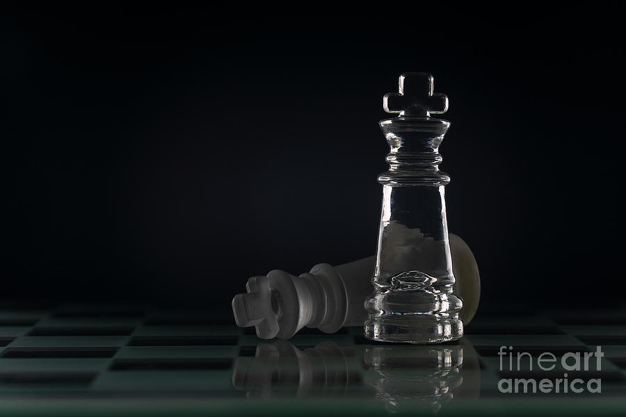 Fallen chess king as a metaphor for fall from power black background copy space macro Photograph by Pablo Avanzini