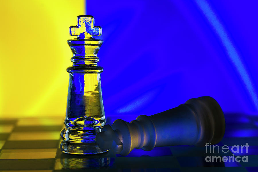 Fallen chess king as a metaphor for fall from power ukrainian flag background copy space macro Photograph by Pablo Avanzini
