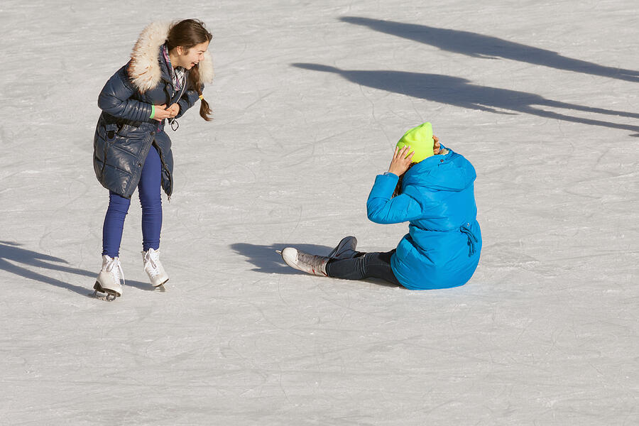 Falling Teenager On The Ice Rink Photograph by Pilin_Petunyia