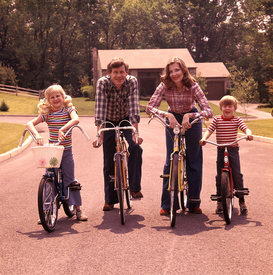 Family 4 Bicycle Portrait Mother Father Boy Girl Bikes Suburban Street House Suburbia Families Retro. Photograph by H. Armstrong Roberts