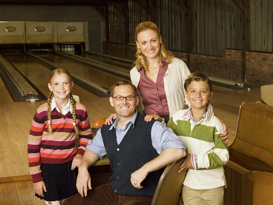 Family at bowling alley Photograph by Image Source