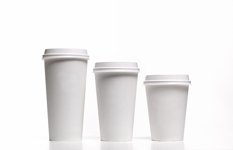 Family of disposable coffee/tea cups Photograph by Peter Dazeley