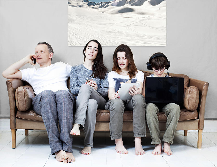 Family on sofa Photograph by Muriel de Seze