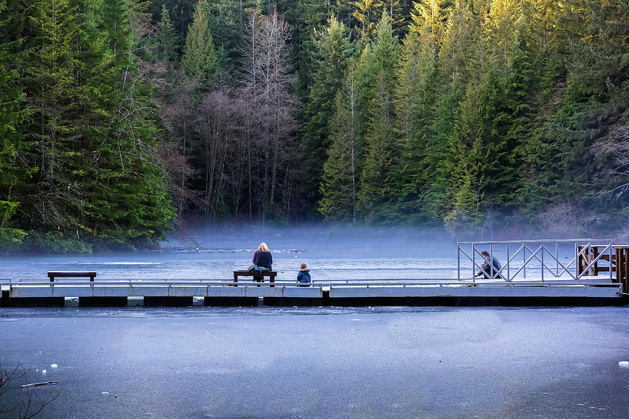 Family on winter ice fishing  Photograph by Alex Lyubar