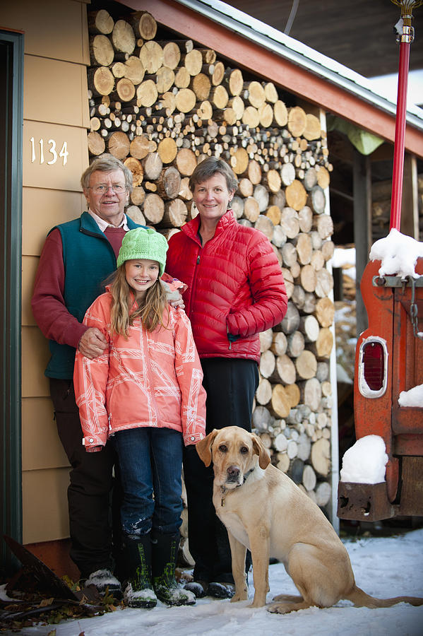 Family outdoor Winter portrait with dog Photograph by Stephen Simpson