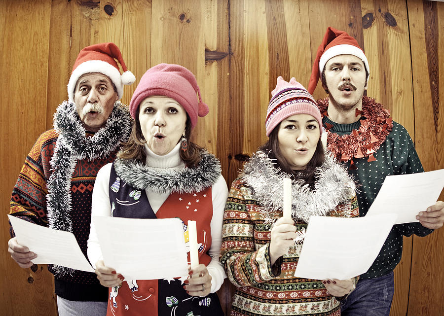 Family singing Christmas songs Photograph by Orbon Alija