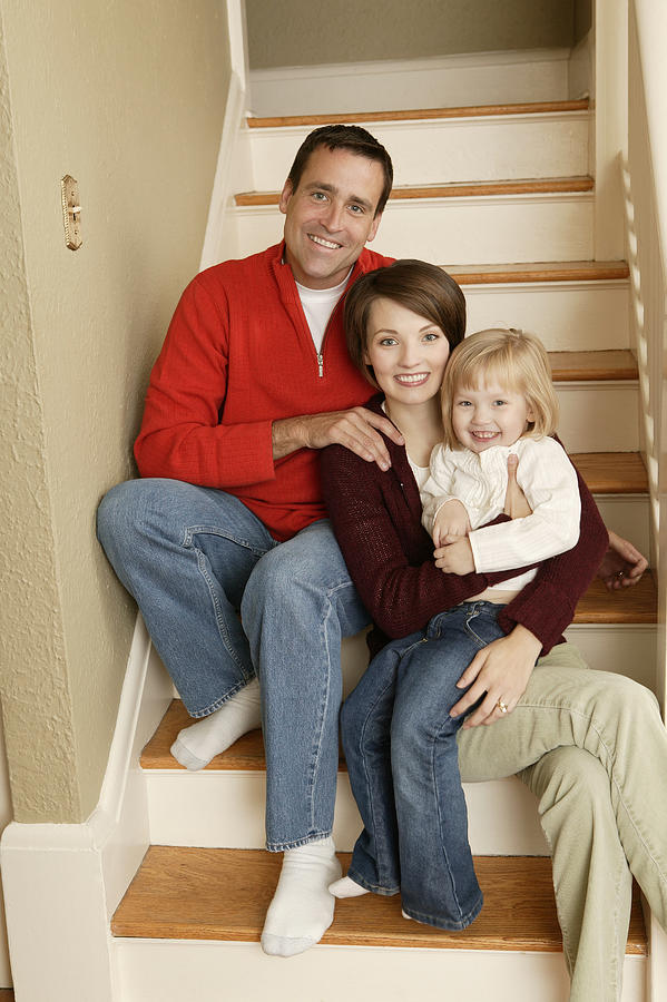 Family sitting on steps Photograph by Comstock Images