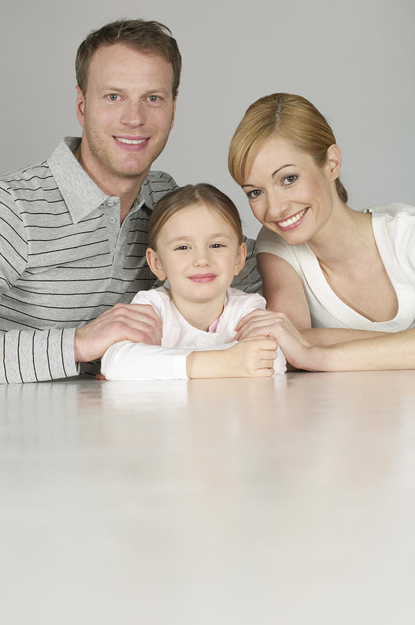 Family smiling at camera Photograph by Stock4b-rf