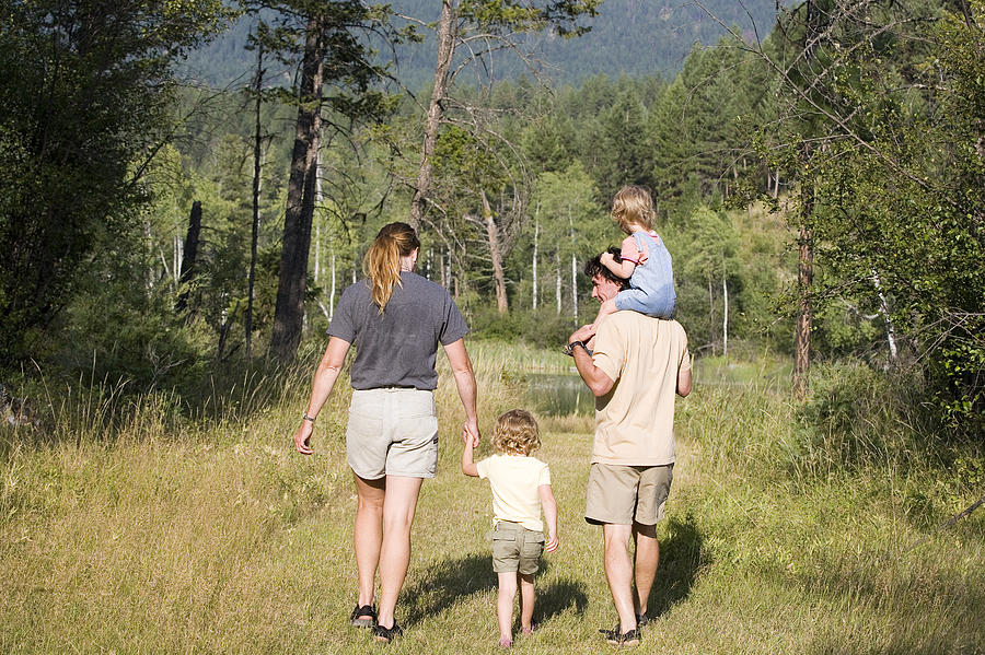 Family walking Photograph by Comstock Images