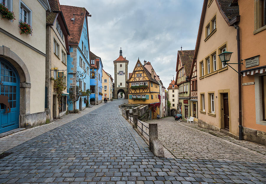 Famous intersection with stunning medieval buildings in Rothenburg Germany Photograph by Michael Godek