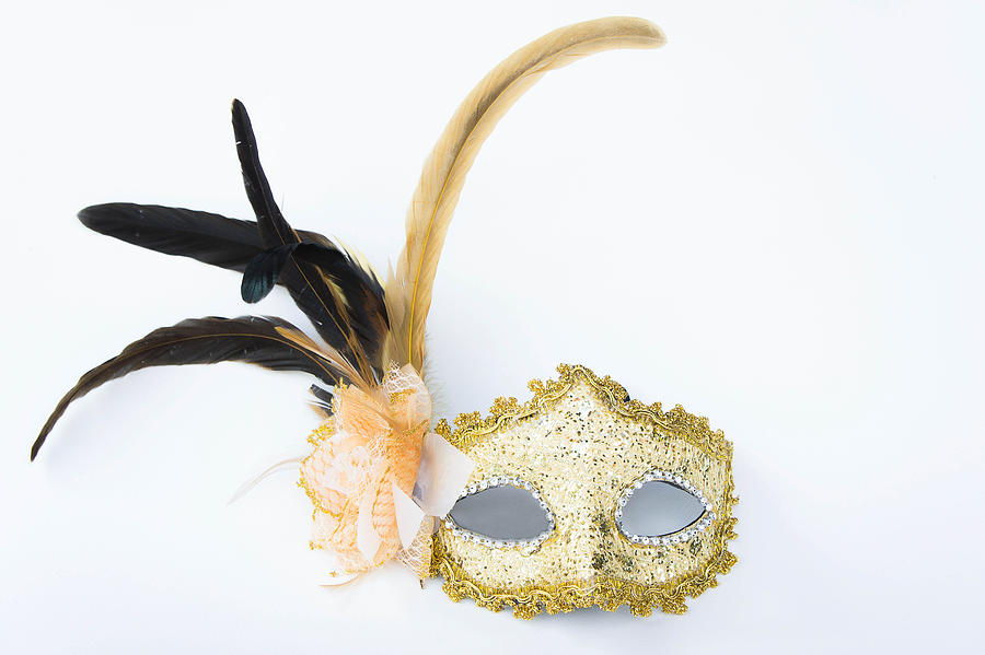 Fancy mask,  accessories obscuring the face of the party. Photograph by AboutnuyLove