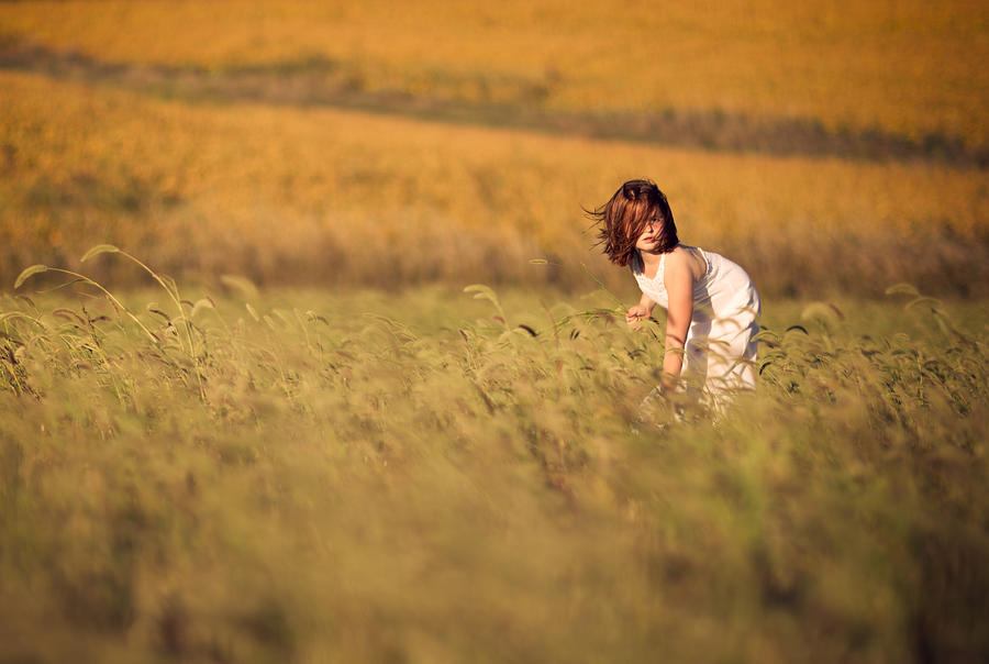 Farm girl in windy grass Photograph by Jake Olson Studios Blair Nebraska