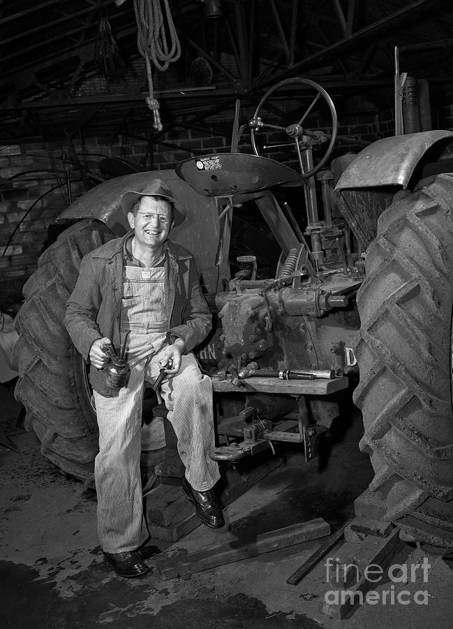 Farmer Working On His Tractor 1946 Photograph