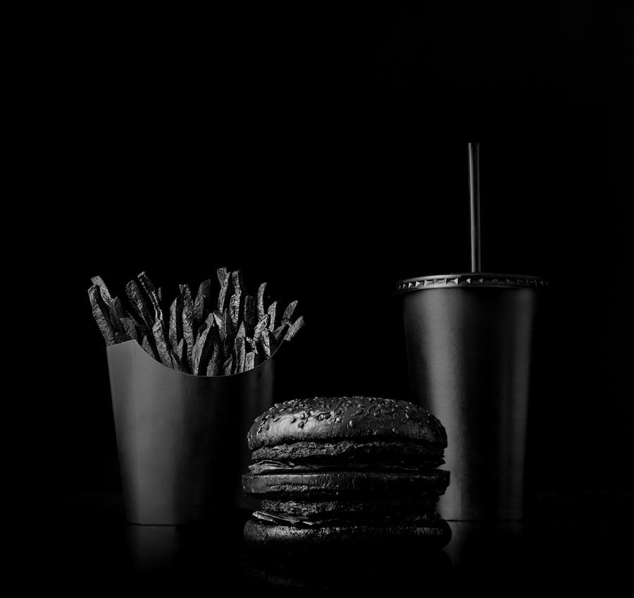 Fast food meal on black backdrop Photograph by Henrik Sorensen