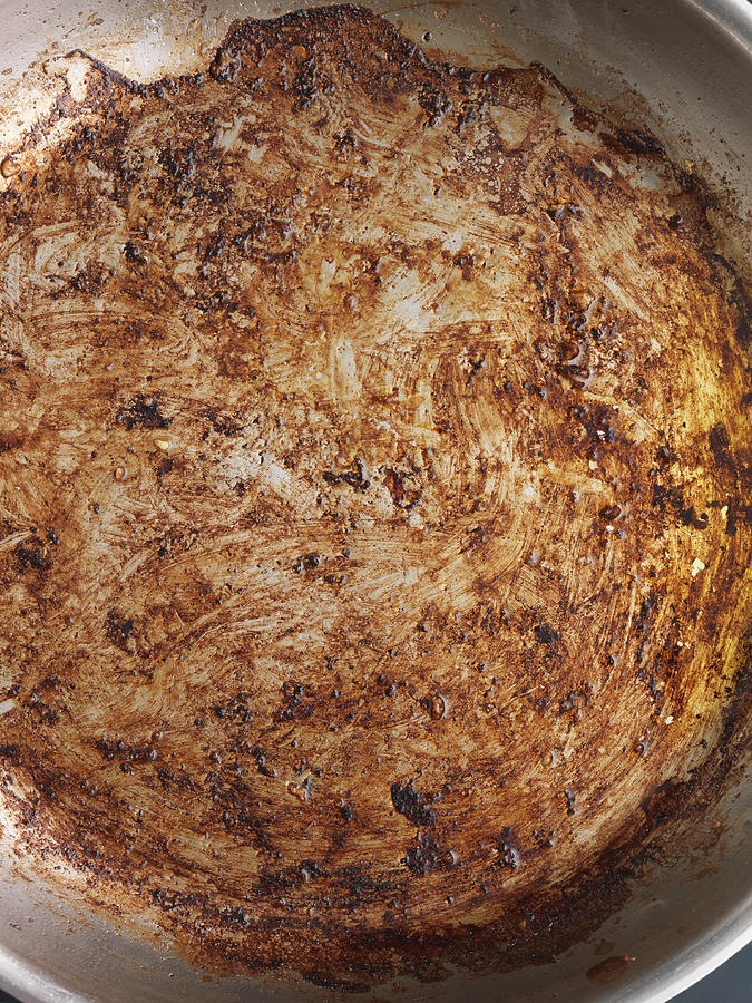 Fat residue in frying pan Photograph by Sean Ellis