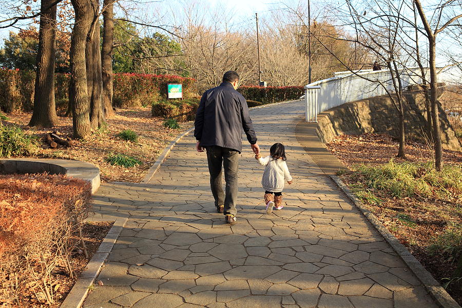 Father and Child walking Photograph by Copyright Crezalyn Nerona Uratsuji