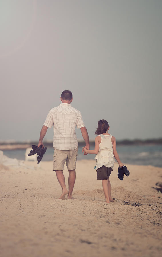 Father and daughter holding hands Photograph by Ambre Haller