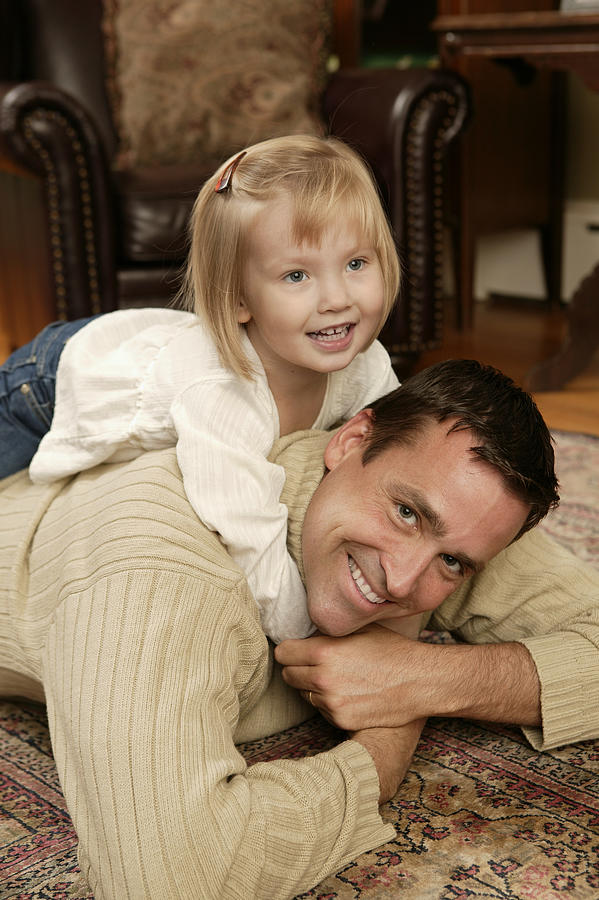 Father and daughter playing Photograph by Comstock Images
