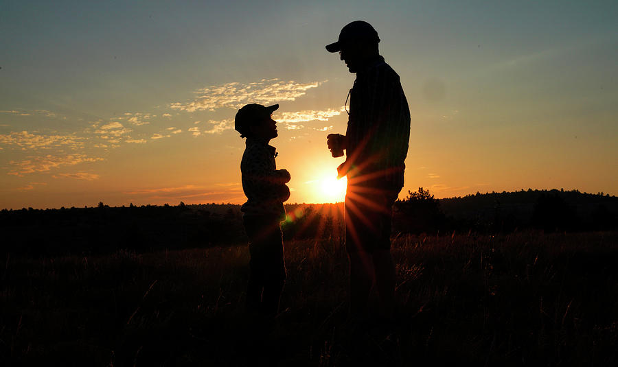 Father and Son at Sunrise Photograph by Rick Wilking