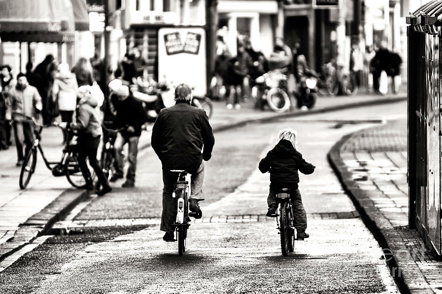 Father and Son Bike Riding in Amsterdam Netherlands Photograph by John Rizzuto