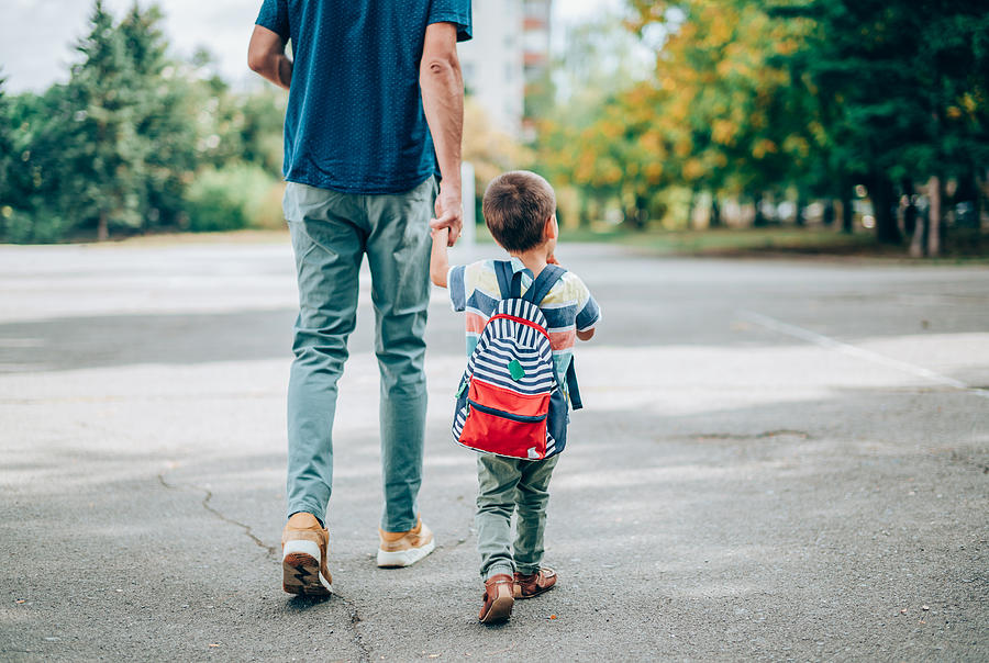 Father and son going to kindergarten. Photograph by VioletaStoimenova