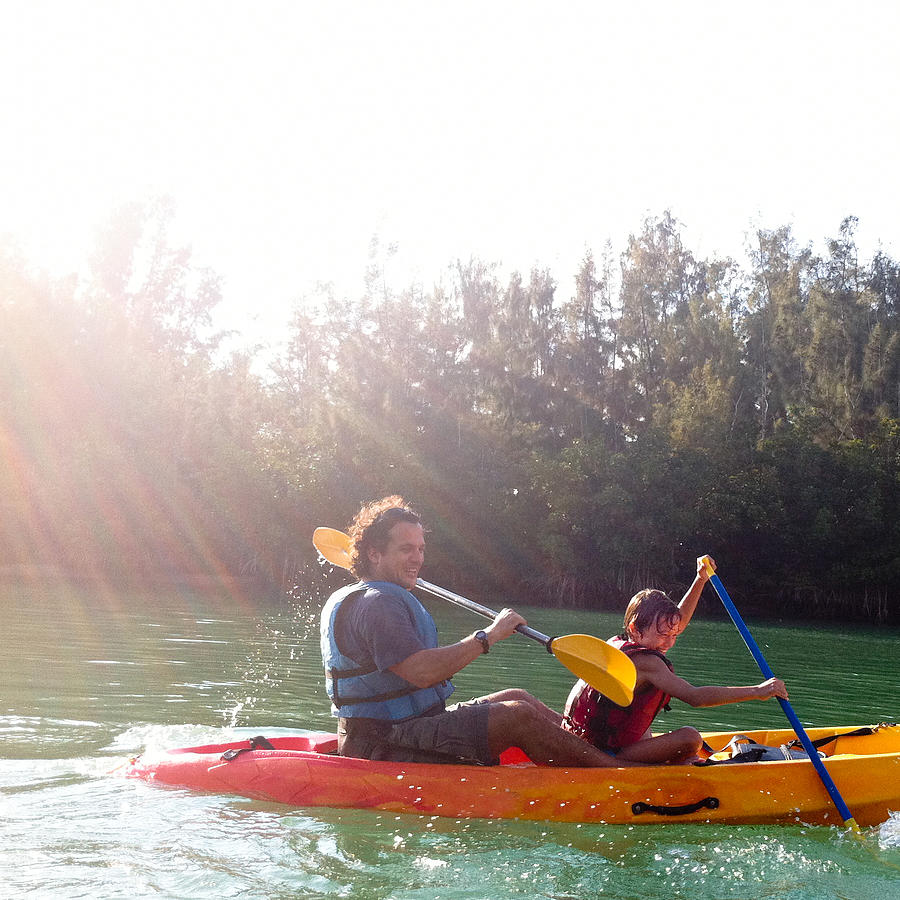 Father and son in kayaking Photograph by Ramiro Olaciregui