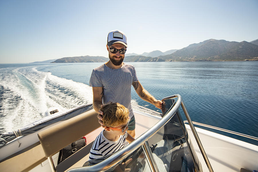 Father and son yachting Photograph by JulPo
